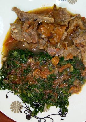 A picture of Goat Meat Stew with Sukuma Wiki.
