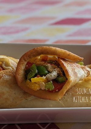 A picture of Moong Dal Pancake with stuffed Paneer and colourful Bell Peppers.