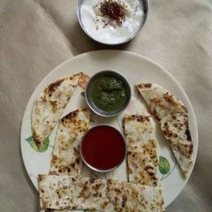 A picture of Punjabi butter paneer stuff kulcha.