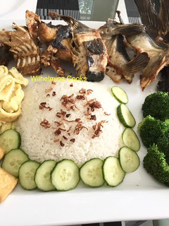 A picture of Fried Blue Catfish with Coconut Rice (Nasi Uduk).