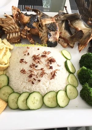 A picture of Fried Blue Catfish with Coconut Rice (Nasi Uduk).