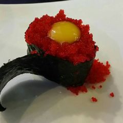 A picture of Brad's nigiri with tobiko and quail egg.