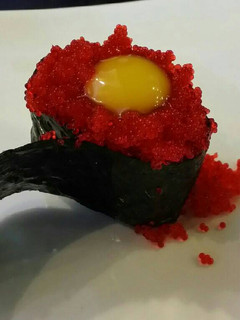 A picture of Brad's nigiri with tobiko and quail egg.