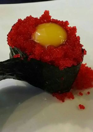A picture of Brad's nigiri with tobiko and quail egg.