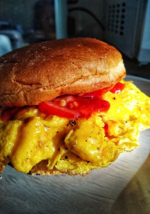A picture of Folded Egg, Tomato & Cheese Breakfast Bap.