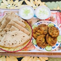 A picture of Aloo kabab with roti.
