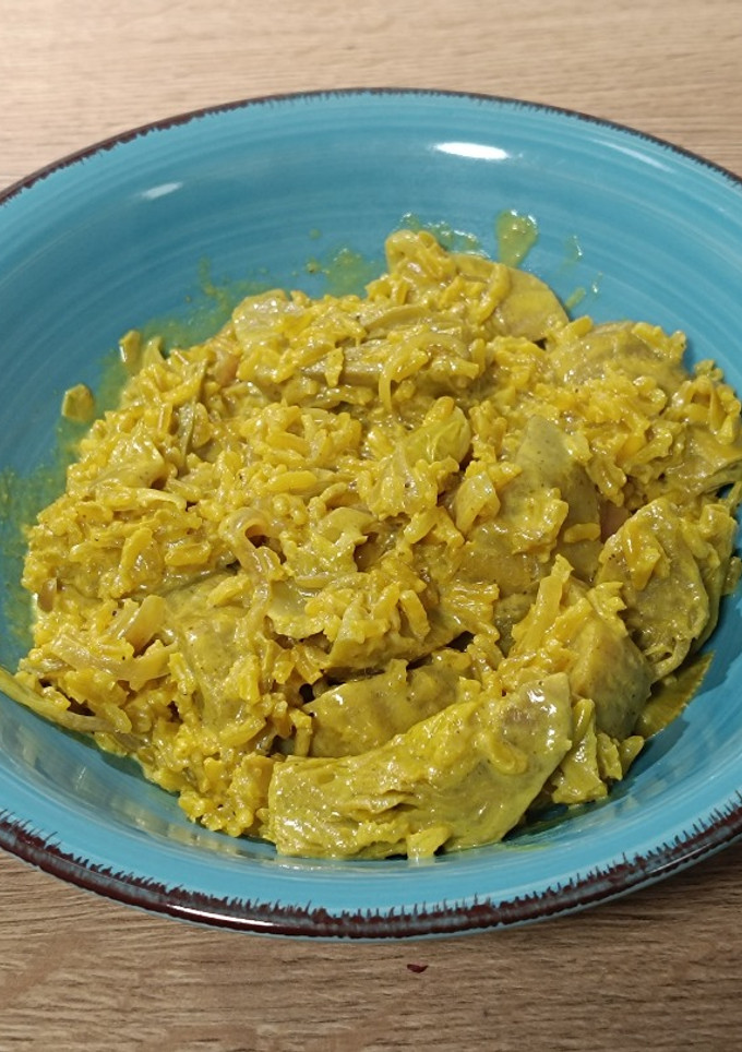 Una foto de Arroz meloso con alcachofas al camembert con especias orientales