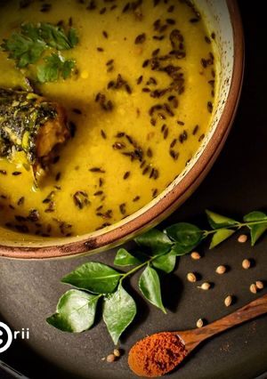 A picture of Moong Dal with fish head-Mach ER matha diye dal.