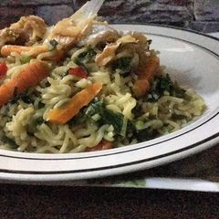 A picture of Noodles veggies with Stockfish flakes.