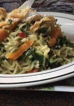 A picture of Noodles veggies with Stockfish flakes.