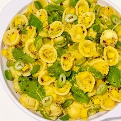 A picture of Orecchiette in Sweet Corn Purée with Lemon, Mint and Parmesan.