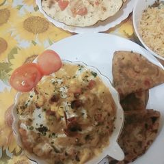 A picture of Hyderabadi blanched with veggies and creamy makhni gravy.