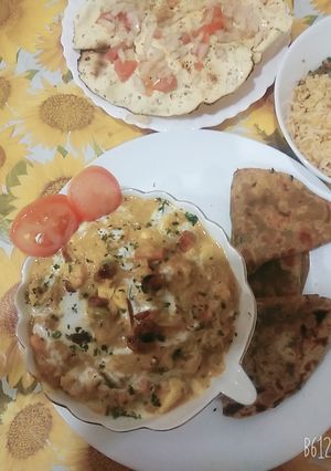A picture of Hyderabadi blanched with veggies and creamy makhni gravy.