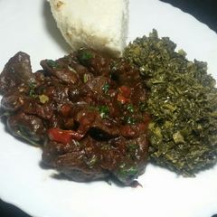 A picture of Liver, Creamed Collard Greens (Skuma wiki) Served with Ugali.