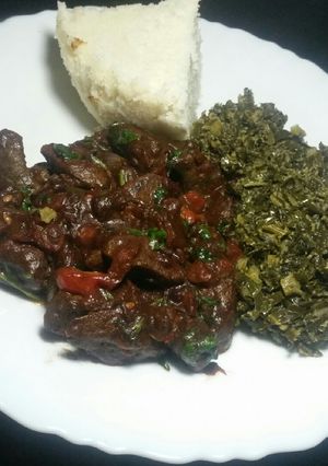 A picture of Liver, Creamed Collard Greens (Skuma wiki) Served with Ugali.