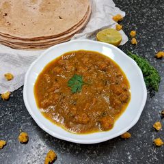 A picture of Moong Dal Vadi Rassa !!.