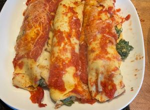 Una foto de Canelones de espinaca y mozzarella con salsa fileto