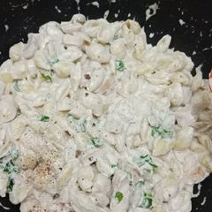 A picture of Penne Alfredo pasta.