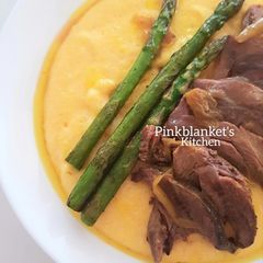 A picture of Creamy Polenta with slow-cooked Lamb Shanks.