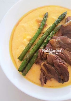 A picture of Creamy Polenta with slow-cooked Lamb Shanks.