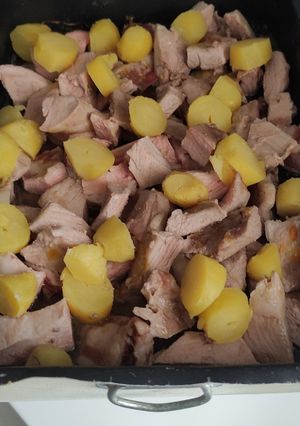 Una foto de Secreto de cerdo con zumo de naranja