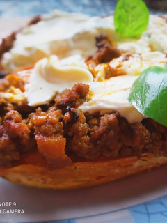 A picture of Sweet Potato Boats with Cream Cheese Sauce with Mint and Lime.