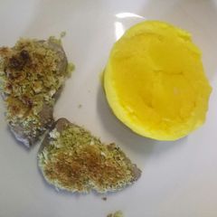 A picture of Pork medallions with garlic and herb crust with saffron mash.