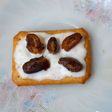 Tuc with fresh cream and date
