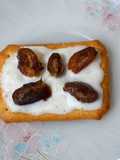 Tuc with fresh cream and date