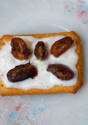 A picture of Tuc with fresh cream and date.