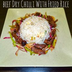 A picture of Beef Dry Chilli With Fried Rice.