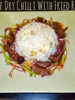 A picture of Beef Dry Chilli With Fried Rice.