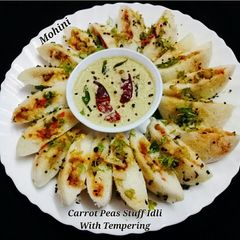 Carrot green peas stuff idli A picture of Carrot green peas stuff idli.
