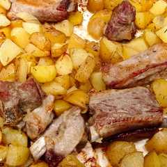 Foto di Costine di maiale e patate al forno