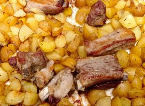 Foto di Costine di maiale e patate al forno