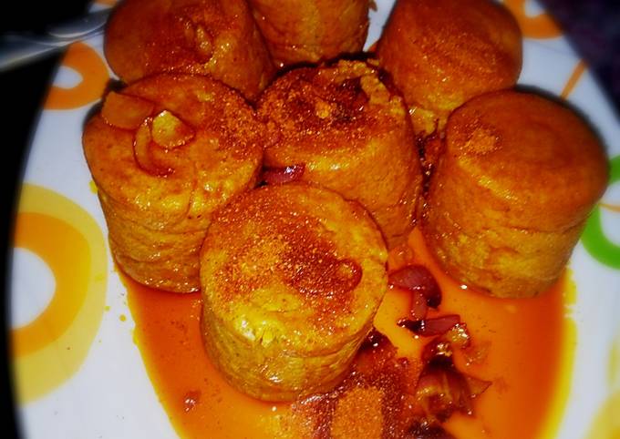 Moi Moi coated with palm oil nd ground pepper (yaji)