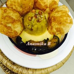 A picture of Simple Navratri Thali: Puri, Begun Bhaja & Halwa.
