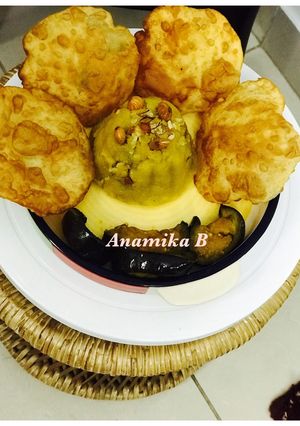A picture of Simple Navratri Thali: Puri, Begun Bhaja & Halwa.