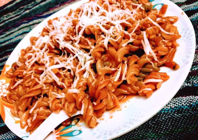 Cheesy schezwan pasta Recipe