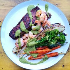Surf and turf / grilled veg / avocado chimichurri A picture of Surf and turf / grilled veg / avocado chimichurri.