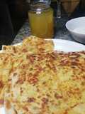 Aalu ka pratha with dahi, aaru ka sharbat aur cookies