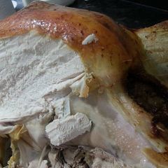 A picture of Roast turkey with festive stuffing.