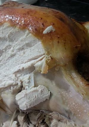 A picture of Roast turkey with festive stuffing.