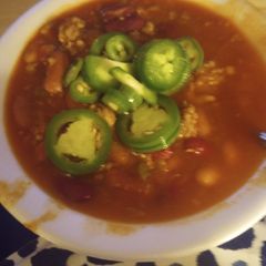 A picture of Chili Cheese with Pickled Peppers.