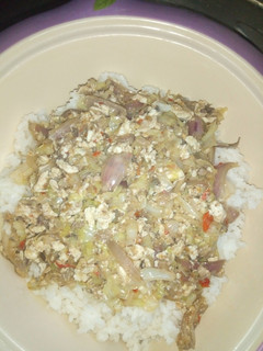 A picture of Miyar cabbage with egg and white rice.