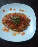 Huarache con milanesa de pollo en salsa de tomate cherry geras. México