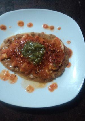 Una foto de Huarache con milanesa de pollo en salsa de tomate cherry geras. México