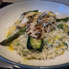 A picture of Chargrilled summer vegetable risotto with lemon and herb chicken.