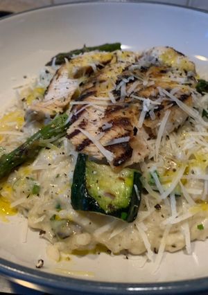A picture of Chargrilled summer vegetable risotto with lemon and herb chicken.