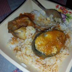 A picture of White rice and stew with fish.